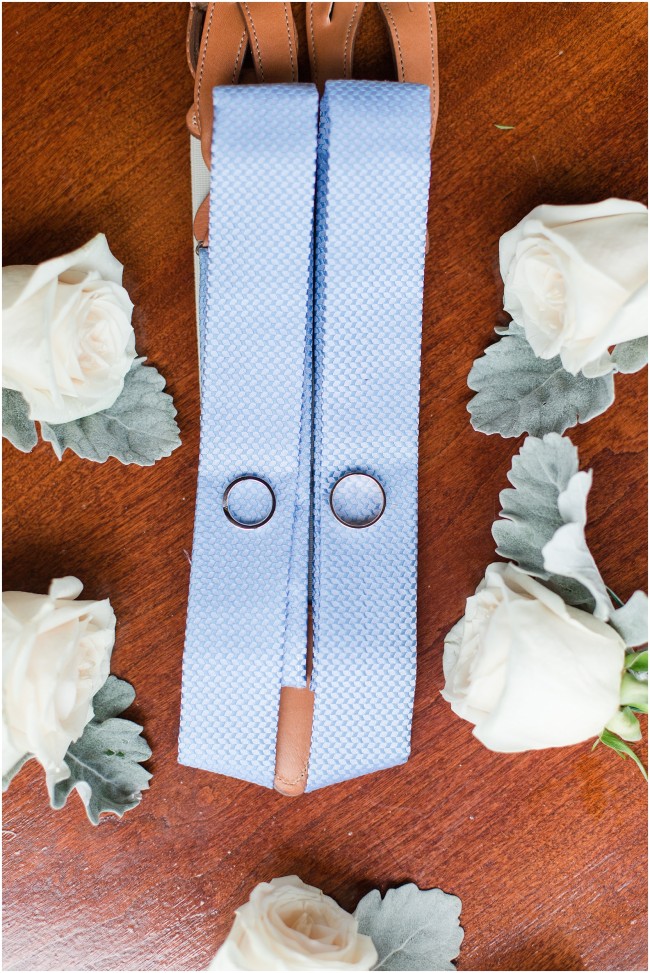 light blue suspenders for grooms attire, wedding band photo detail