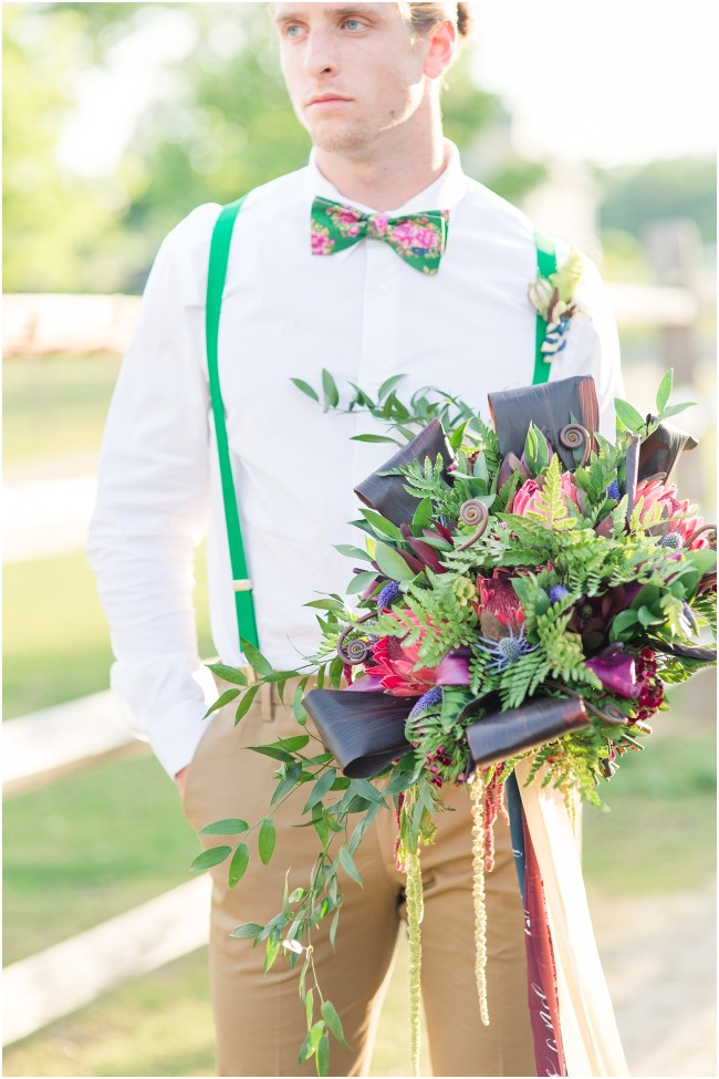 jewel toned wedding bouquet, green suspenders on a groom
