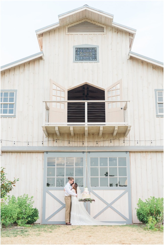 Edel haus barn balcony, bride and groom portraits at the edel haus farm barn