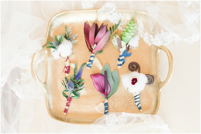 jewel toned wedding details, unique boutonniere designs, jewel toned boutonnieres on a gold vintage tray