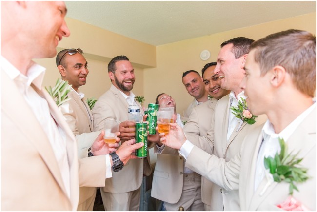 groomsmen toast at grooms prep