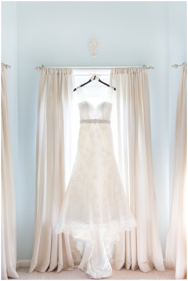 Augusta Jones bridal gown hanging in window