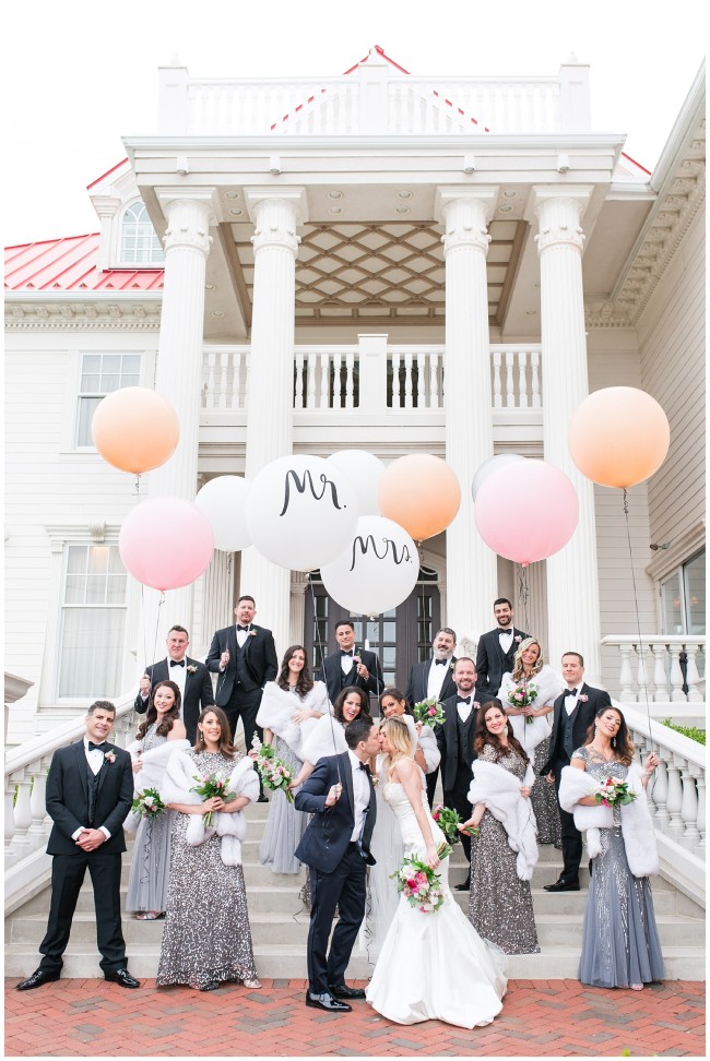 bridal party outside of Mallard Island Yacht Club with giant balloons
