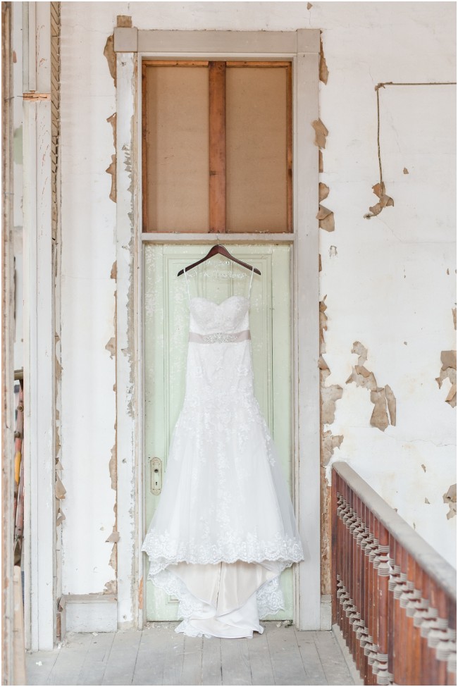 alfred angelo wedding gown hanging at excelsior wedding venue