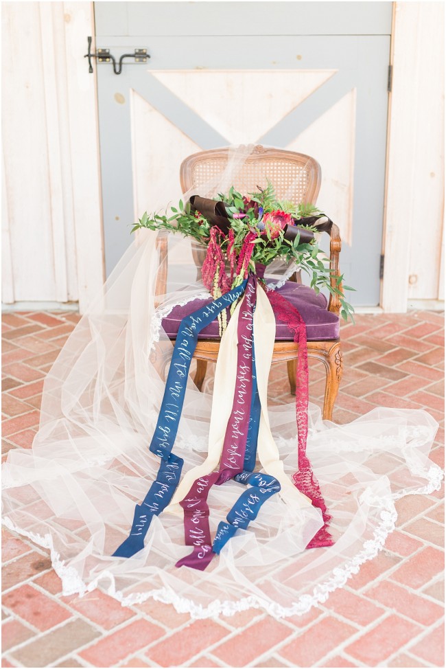 Silk ribbon tied around a wedding bouquet, jewel-toned wedding details
