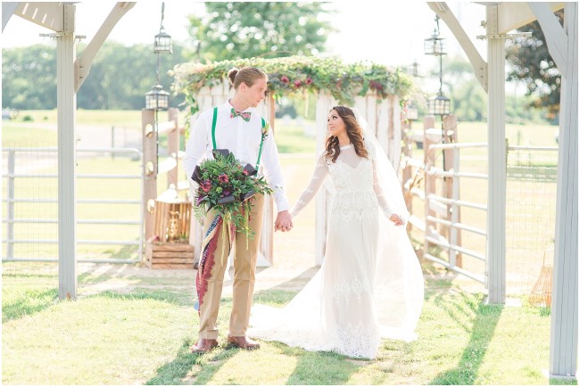bride and groom under edel haus farm arbor, jewel toned wedding bouquet