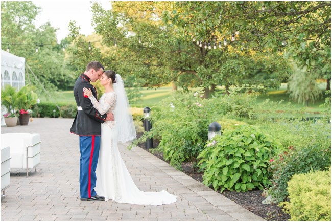 marine and his bride, portraits at windows on the water wedding