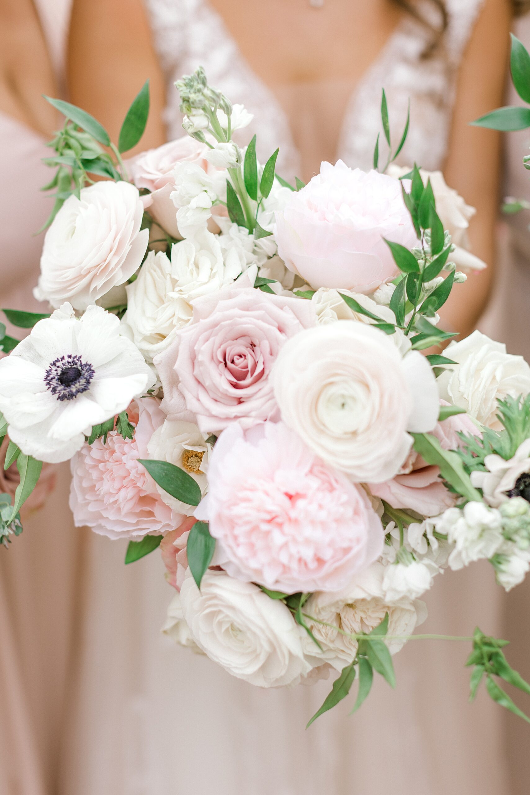 bride holds pink and white bouquet at the Ashford Estate