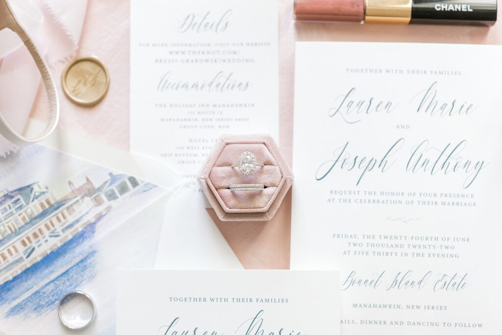 wedding ring in pale pink box on custom invitations 