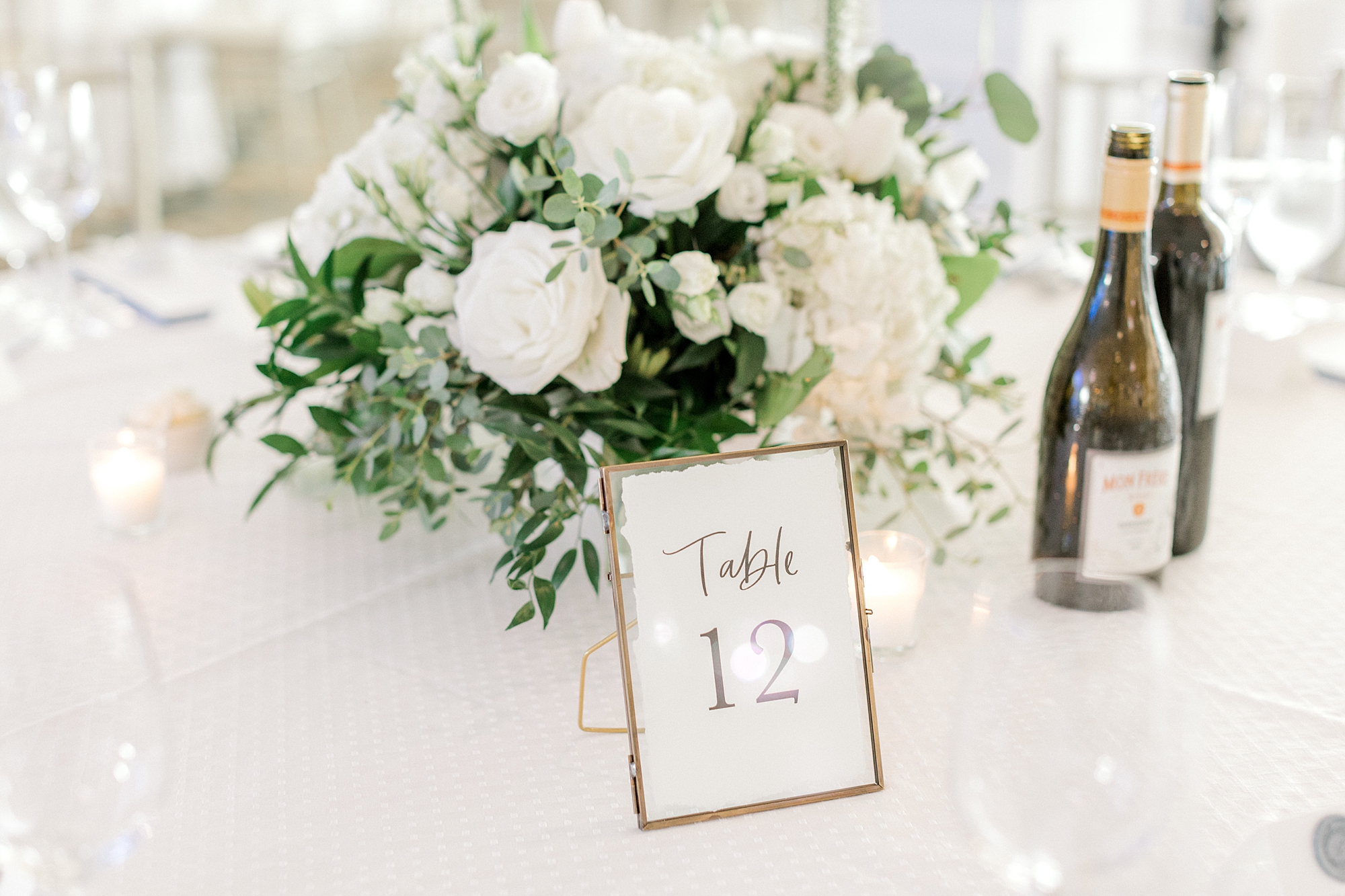table numbers in gold frame at Crystal Point Yacht Club