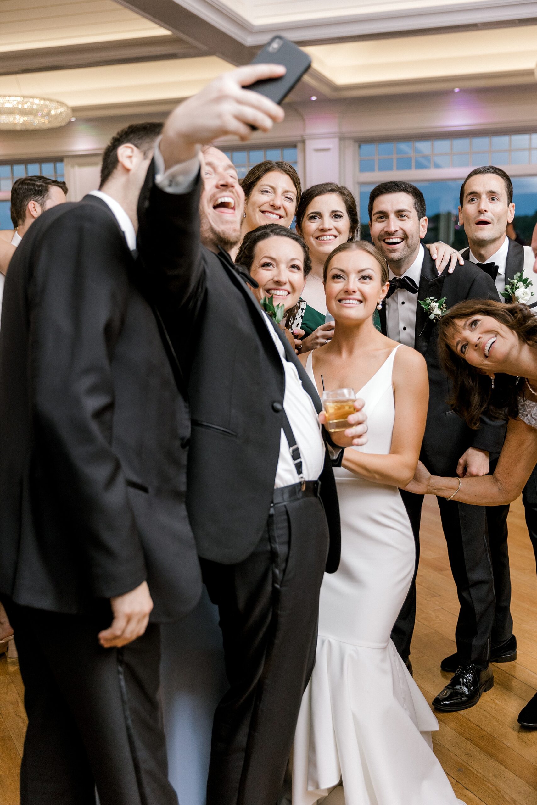 bride and groom take selfie with guests during New Jersey wedding reception