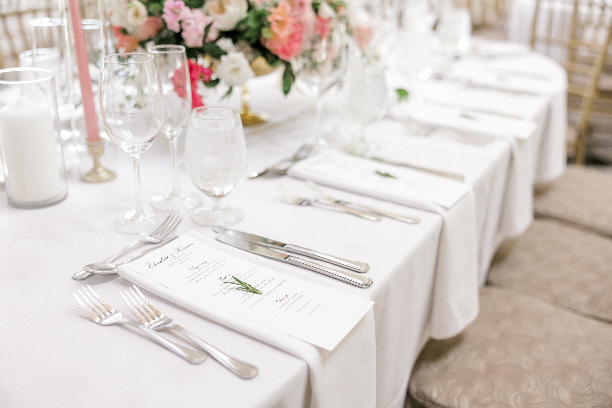 place settings with menu cards and white napkins