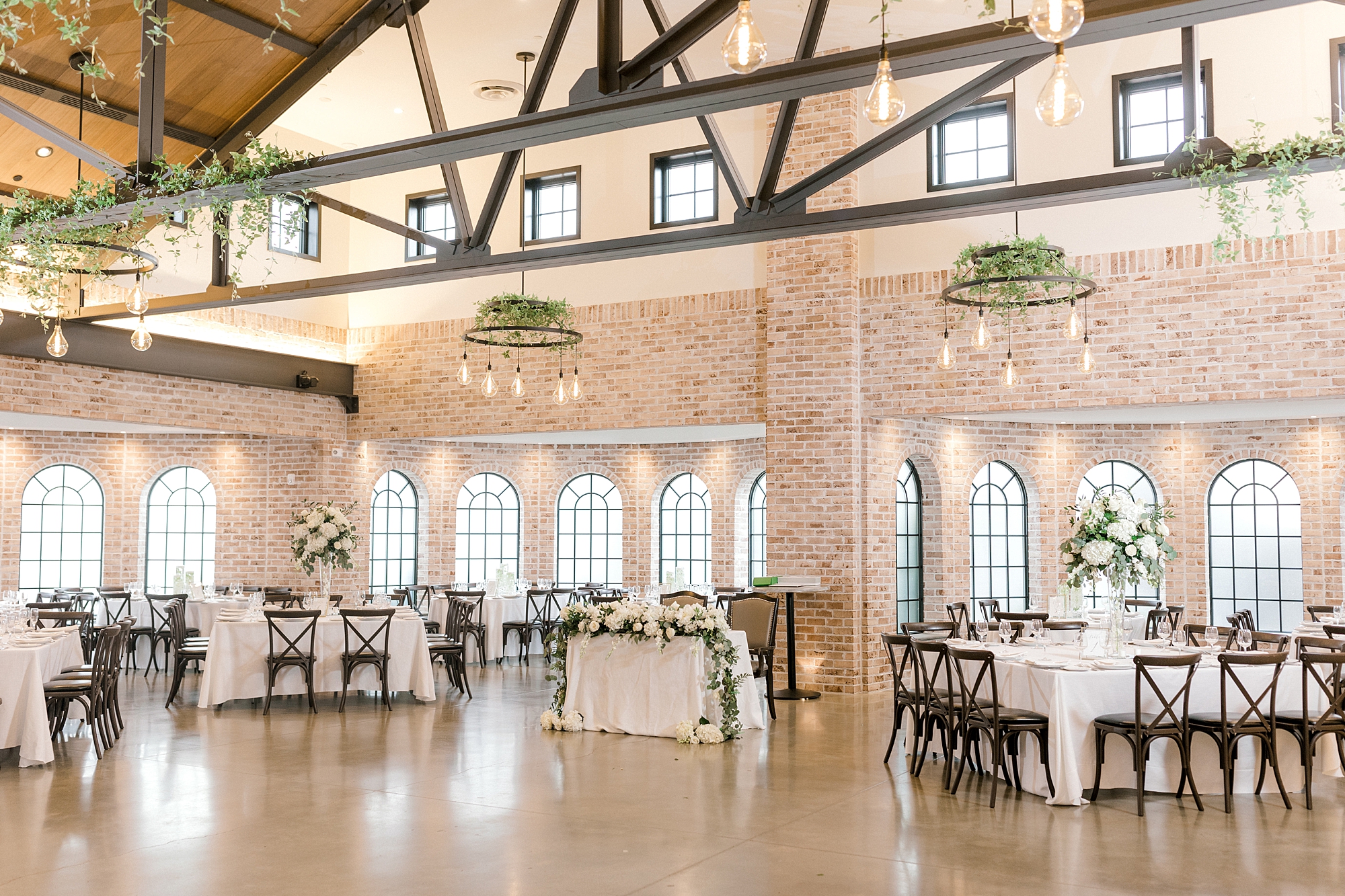 wedding reception at The Refinery at Perona Farms in room with brick walls