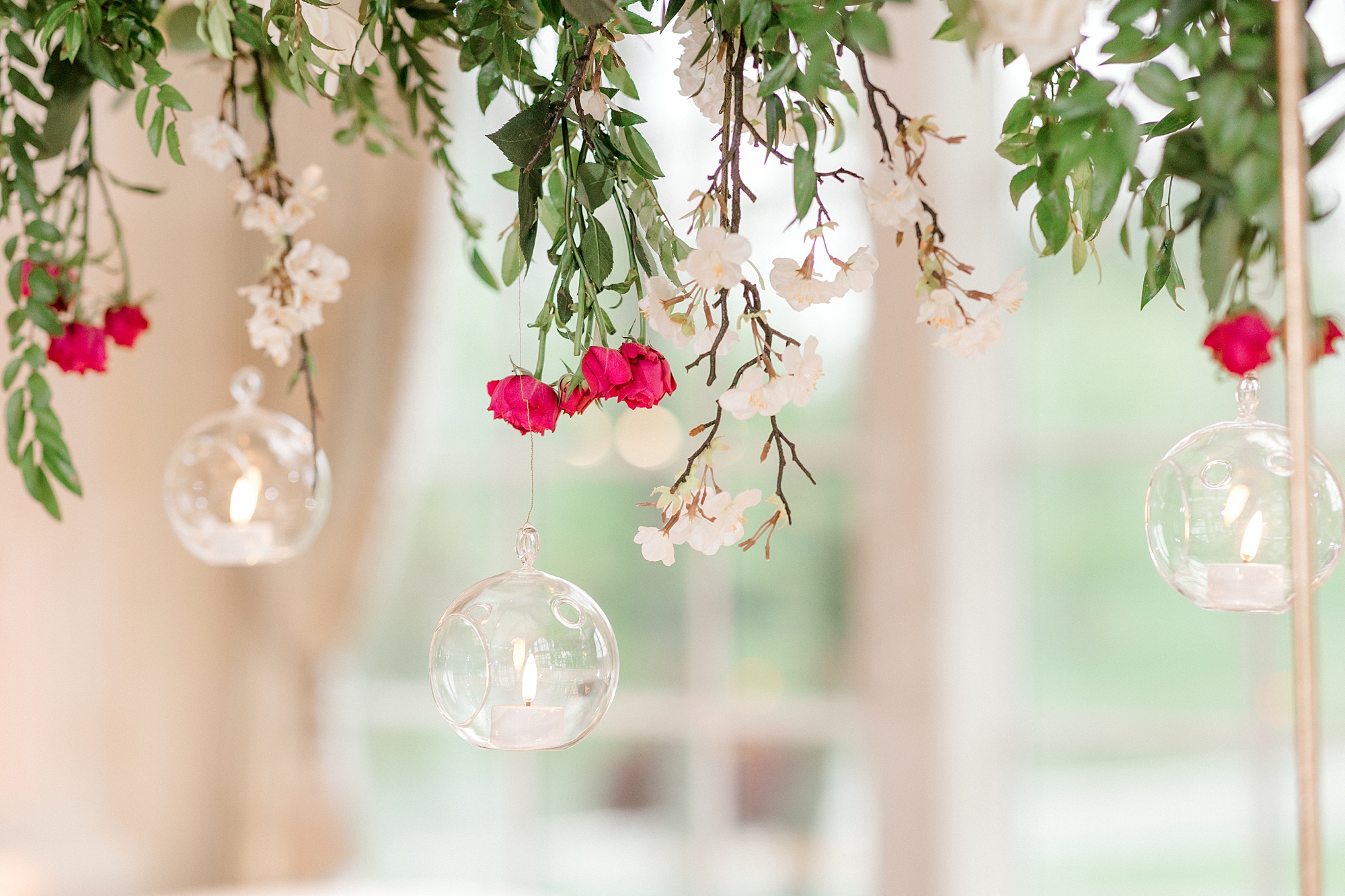 wedding florals hang with glass bulbs at The Ashford Estate