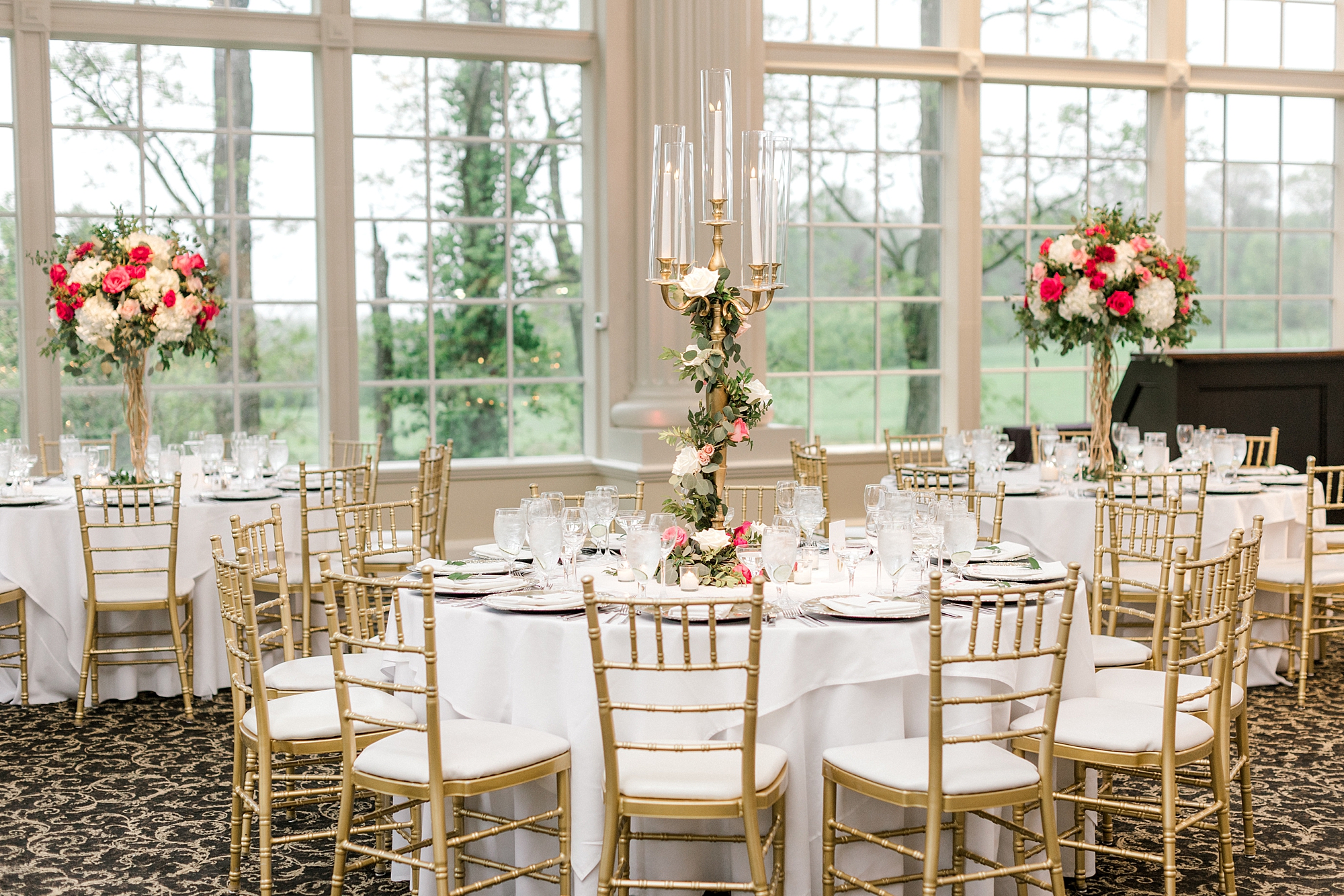 wedding reception table with tall floral centpeirece at The Ashford Estate