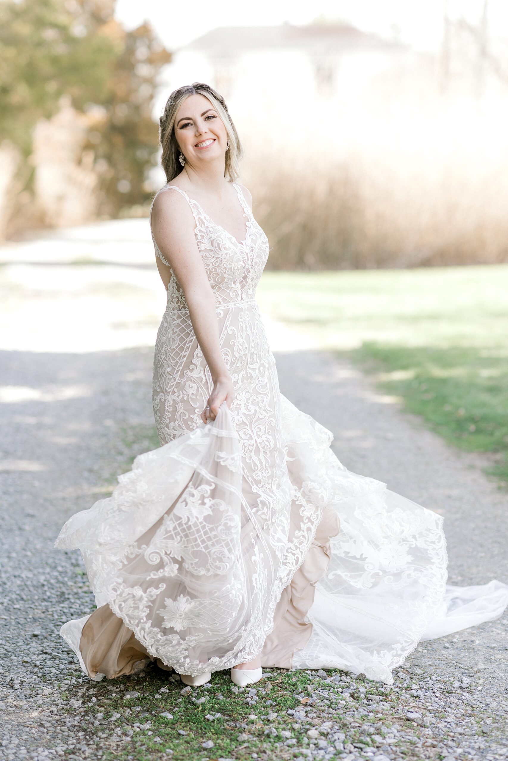 brie twirls in wedding gown with ivory lace