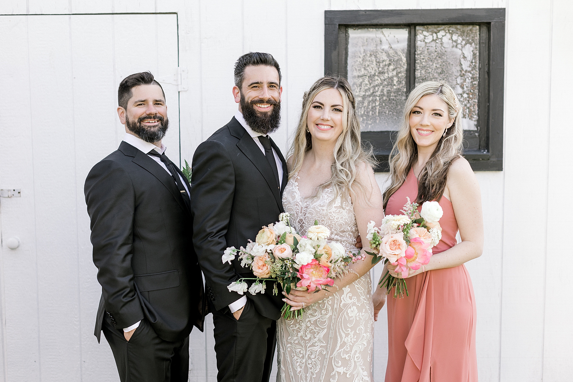 newlyweds stand with best man and maid of honor during intimate wedding at The Townsend Property