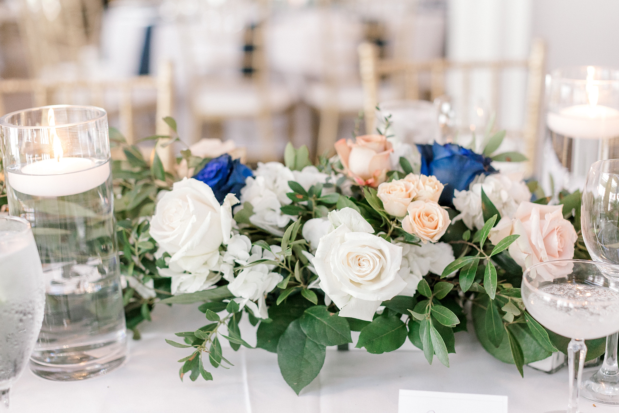 wedding reception centerpiece with white and peach roses