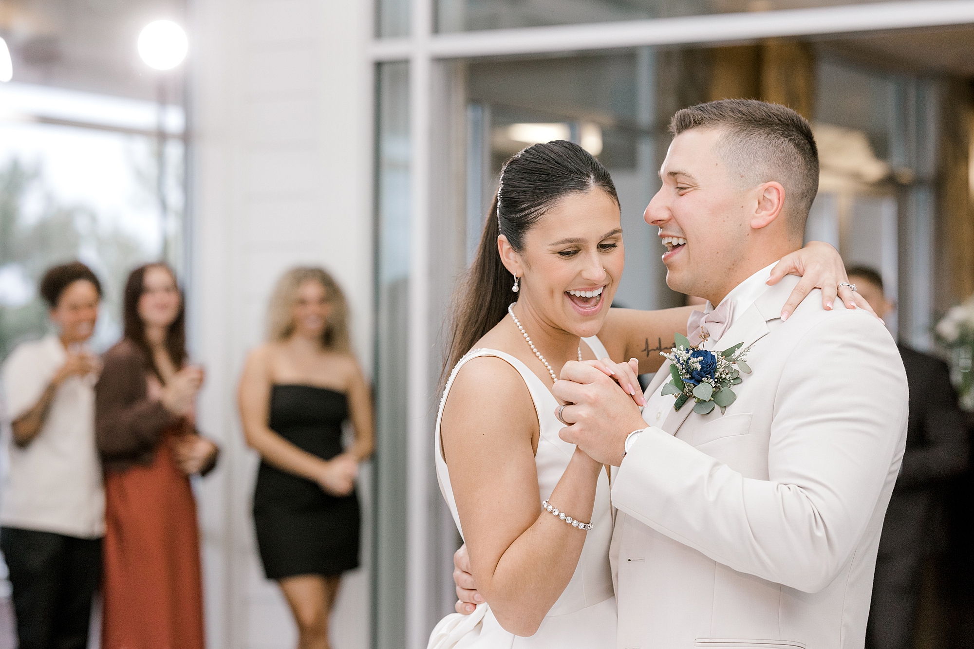 bride and groom laugh dancing together during Mallard Island Yacht Club wedding reception