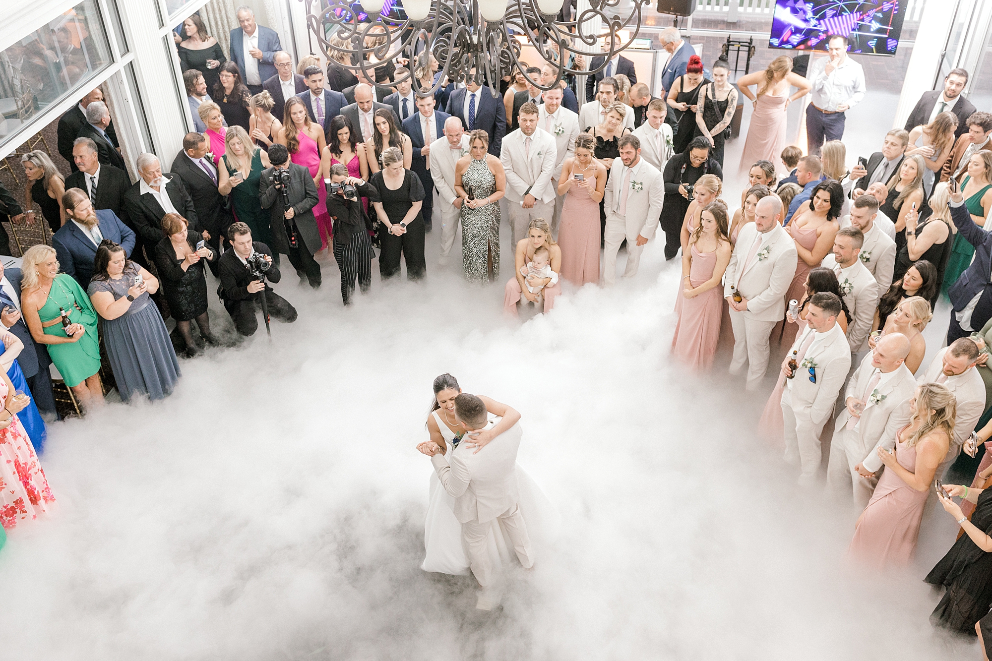 bride and groom have first dance in fog at Mallard Island Yacht Club