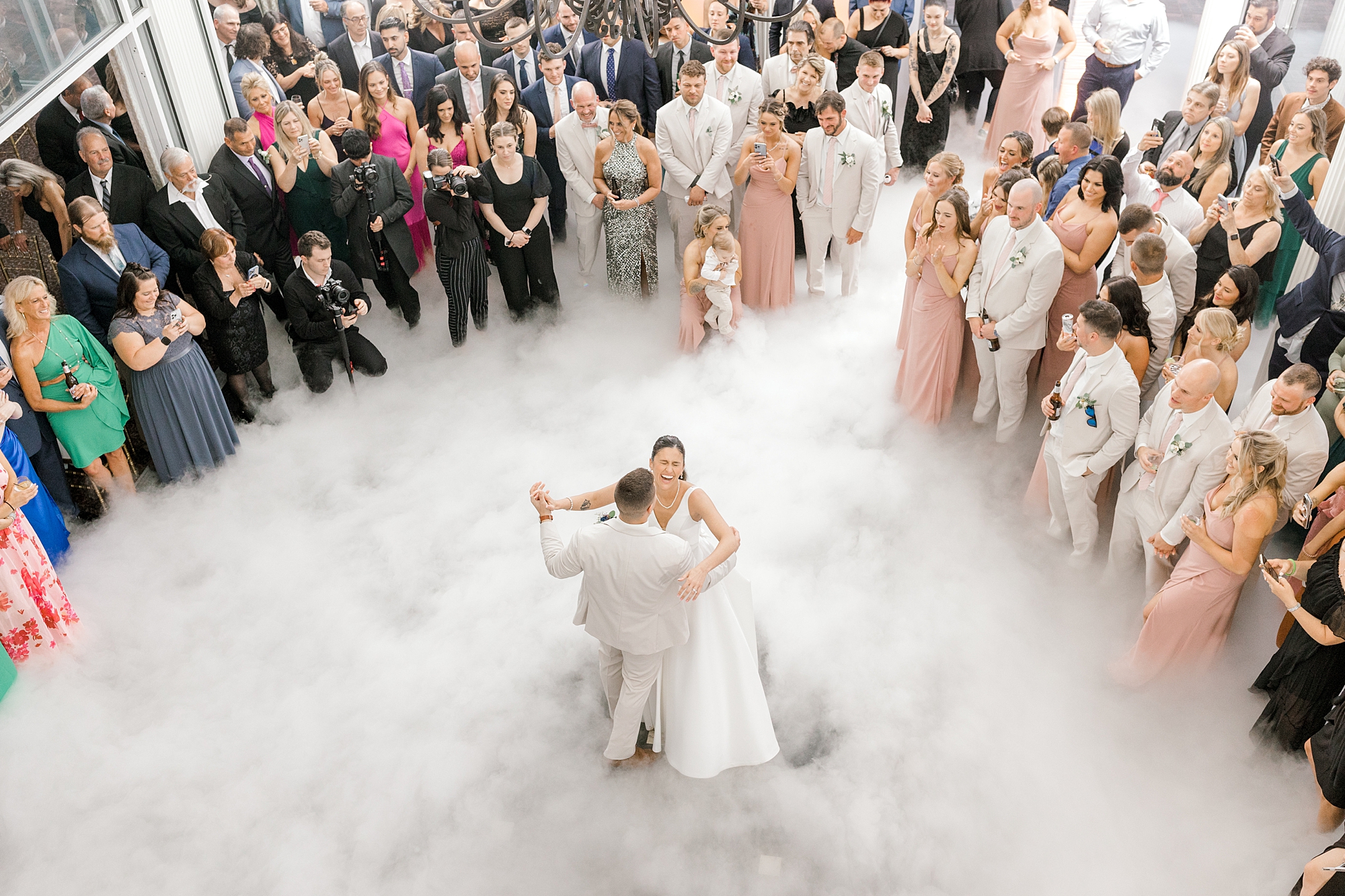 bride and groom dance during Manahawkin NJ wedding reception in fog