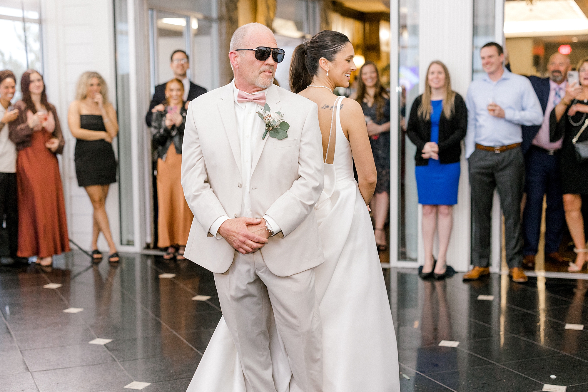 bride and dad put on sunglasses for dance