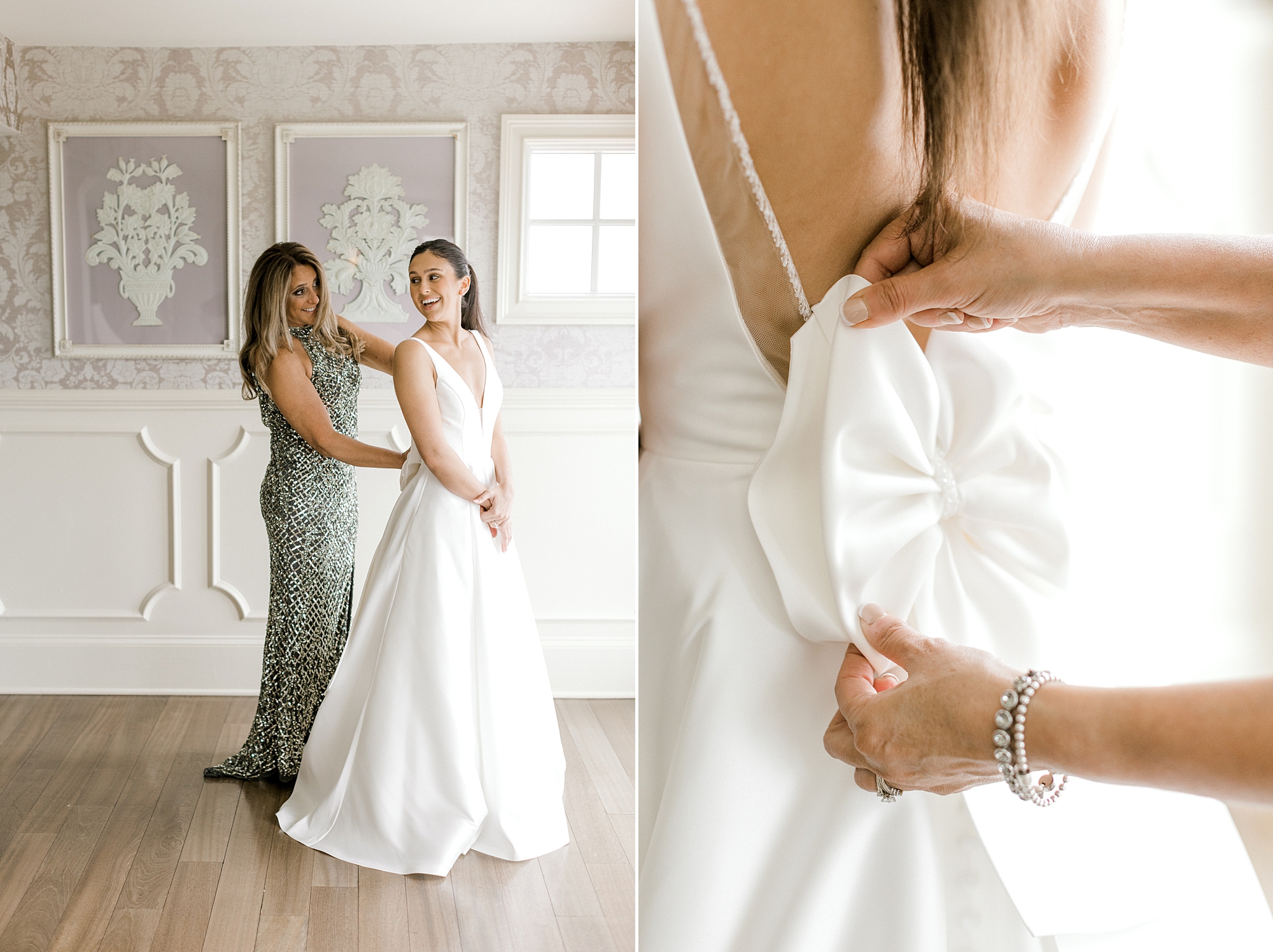 mother adjusts bow on back of wedding gown for bride