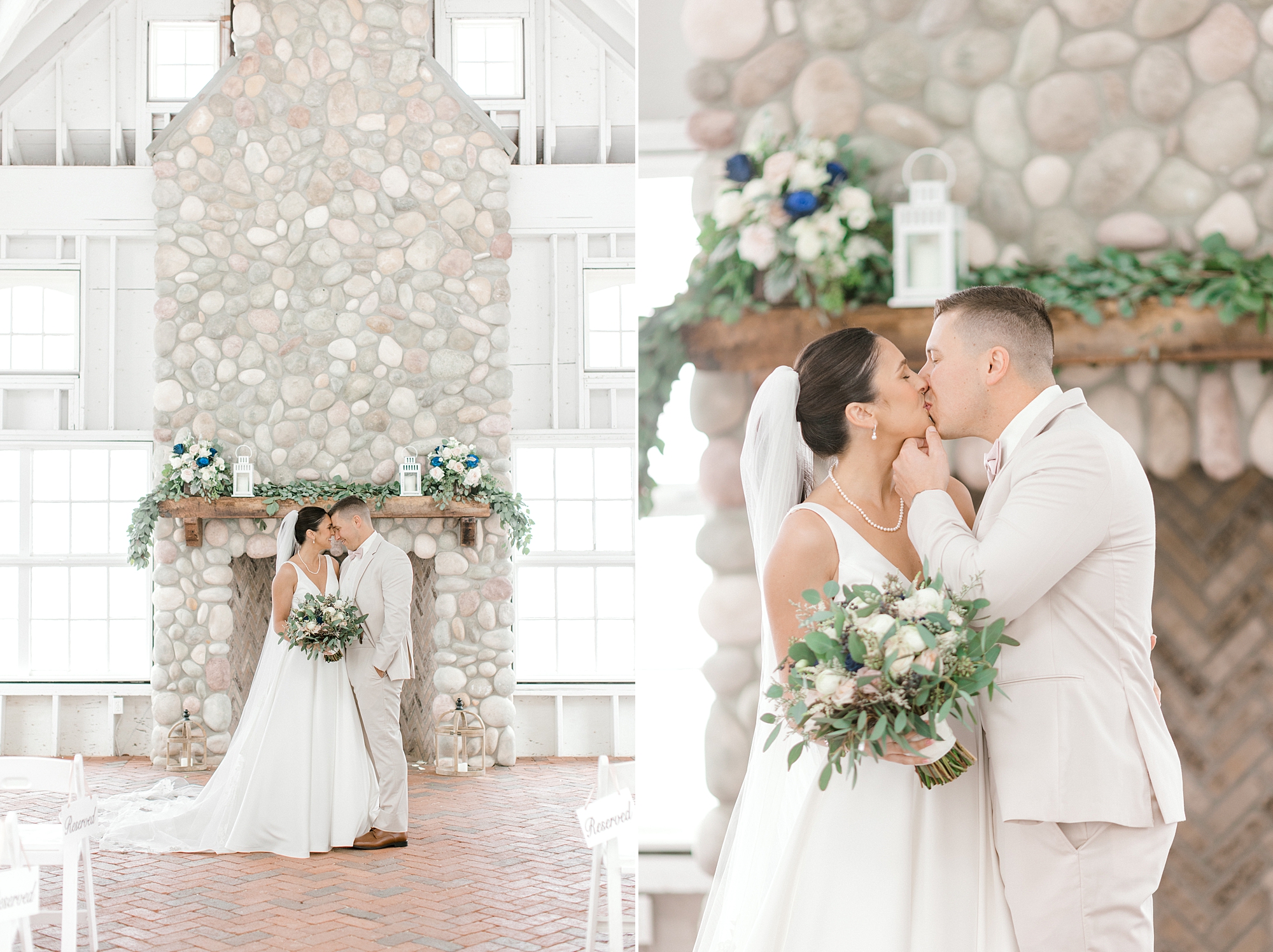 bride and groom hug in front of stone fireplace with green and white garland