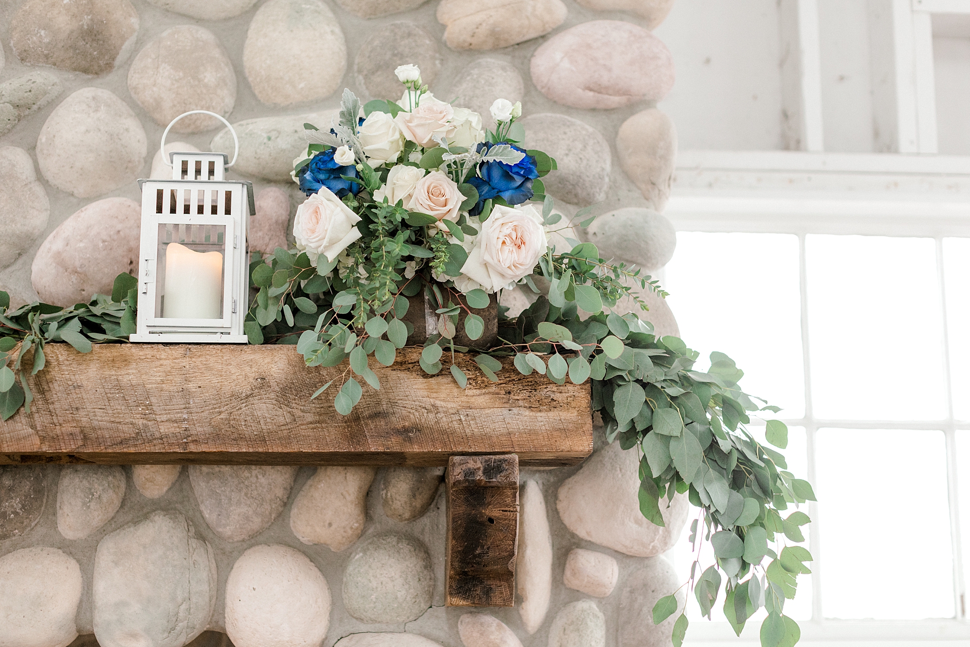 white and blue floral garland for fireplace at Mallard Island Yacht Club