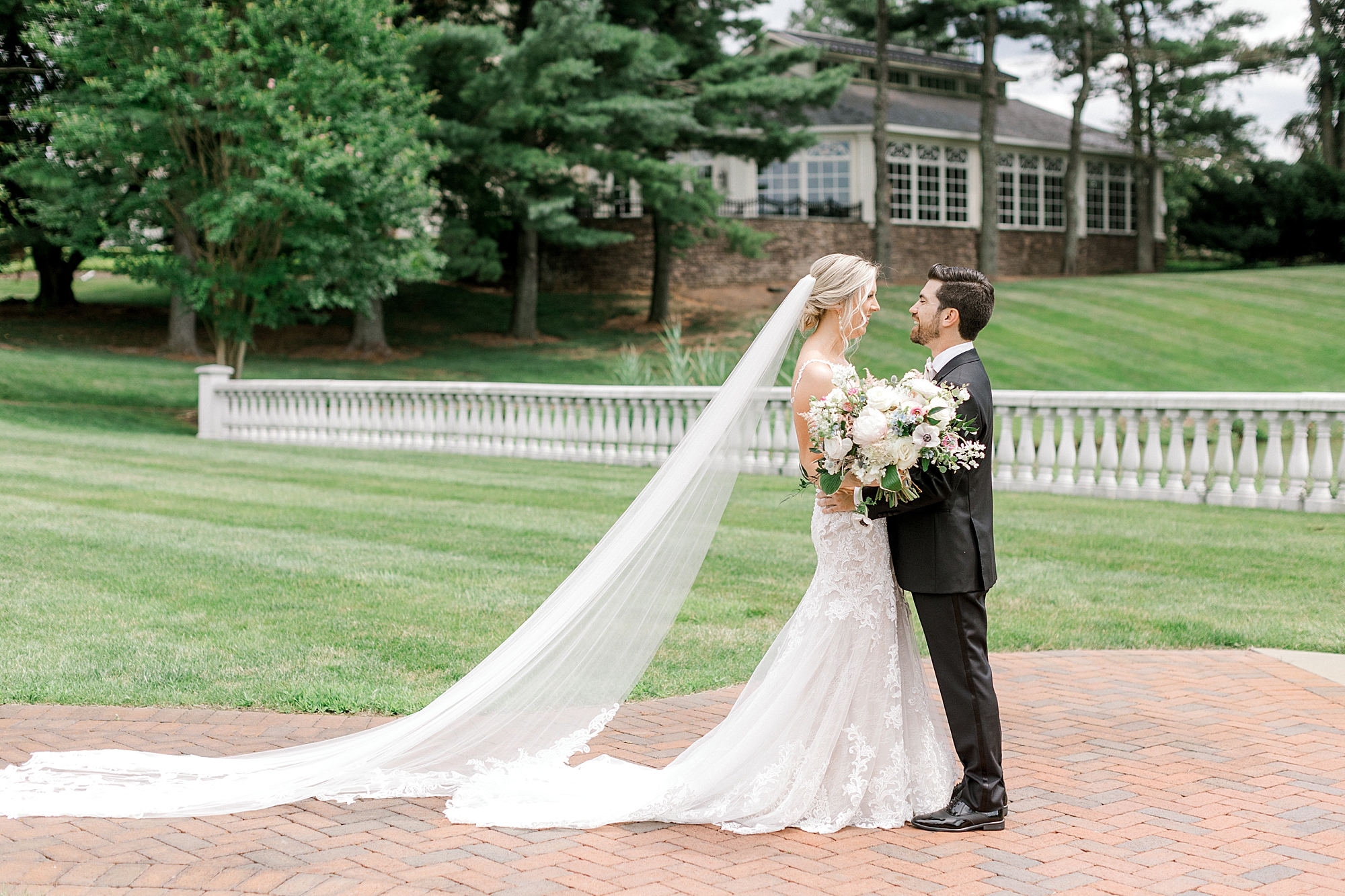 newlyweds hug during first look at the Ashford Estate