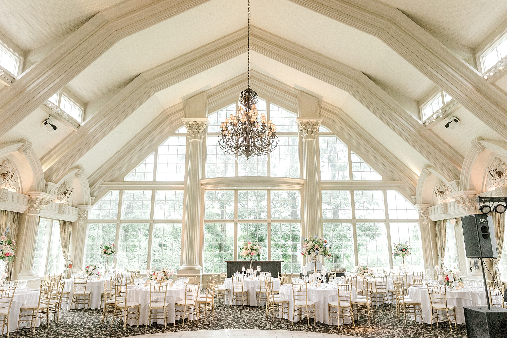 classic Sumer wedding reception at the Ashford Estate by window of ballroom