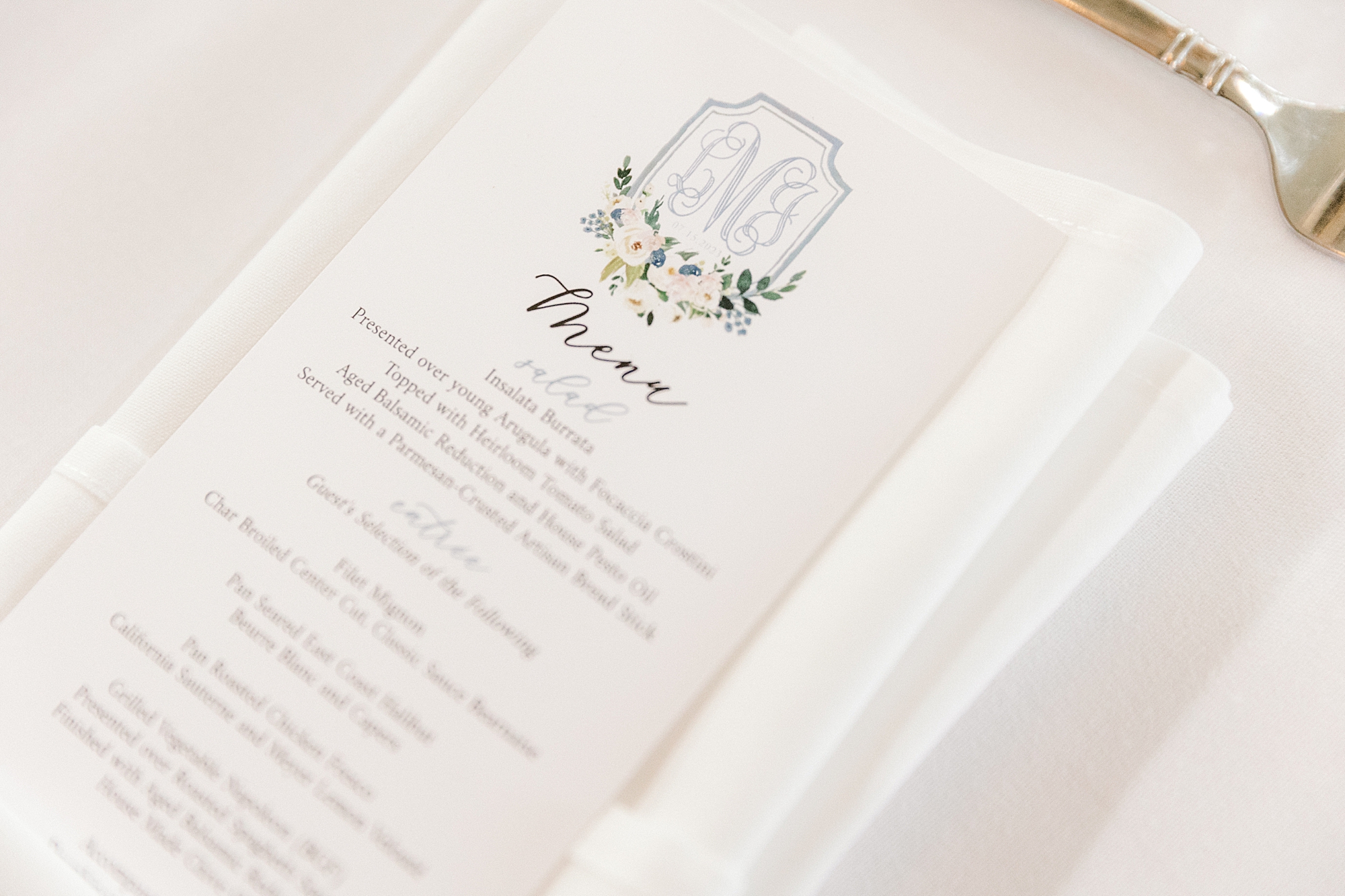 menu card with blue crest for classic Sumer wedding reception at the Ashford Estate