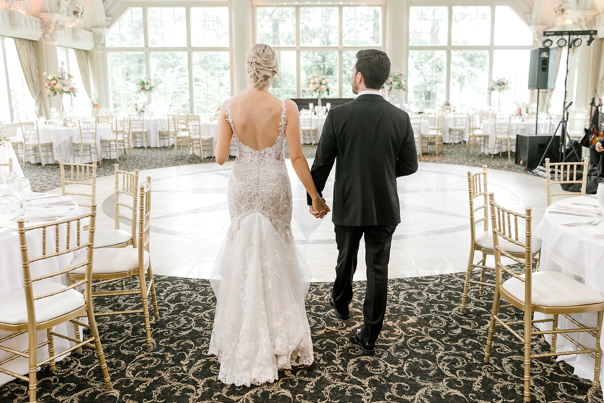 bride and groom walk into wedding reception at Ashford Estate