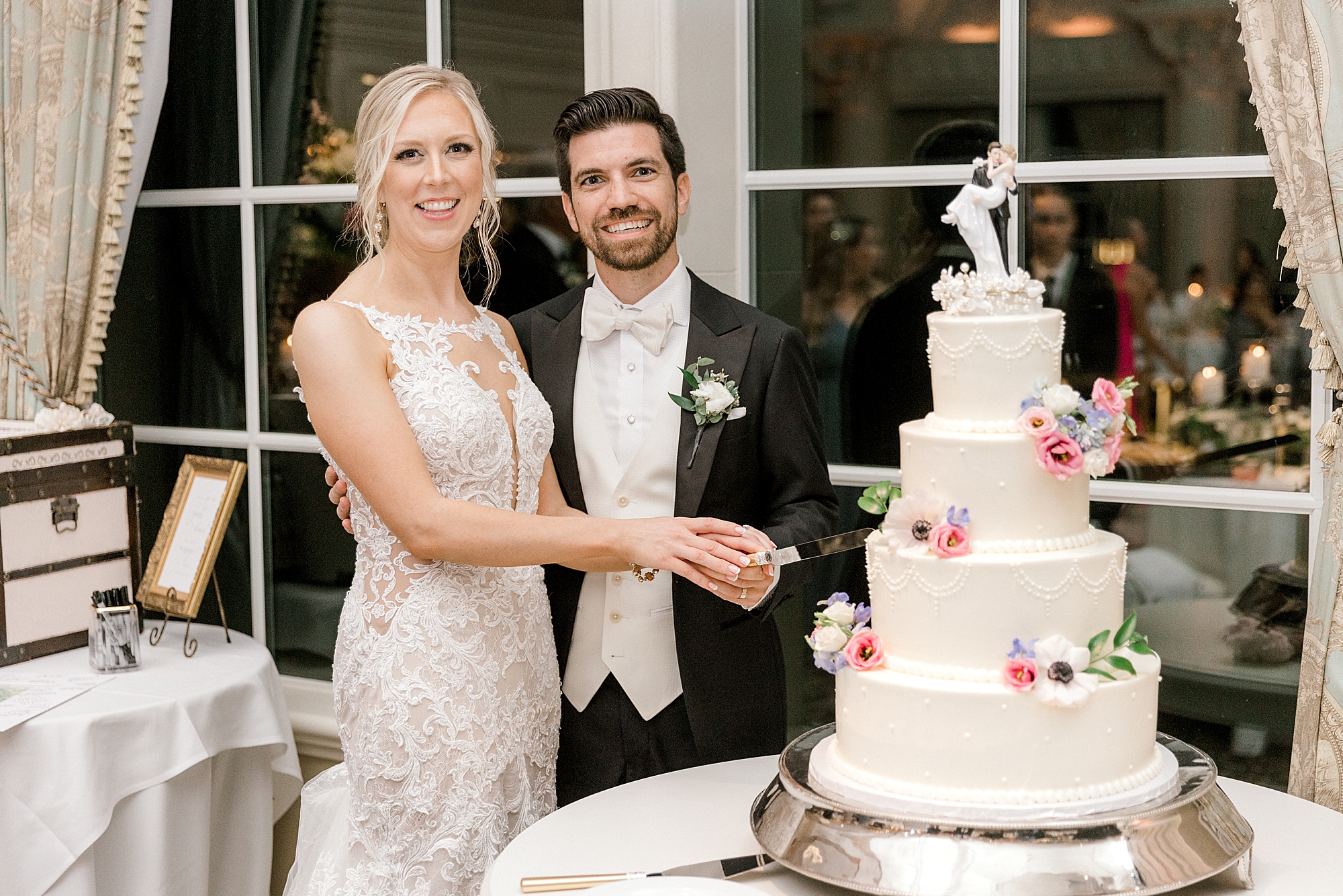 bride and groom cut cake at NJ wedding reception