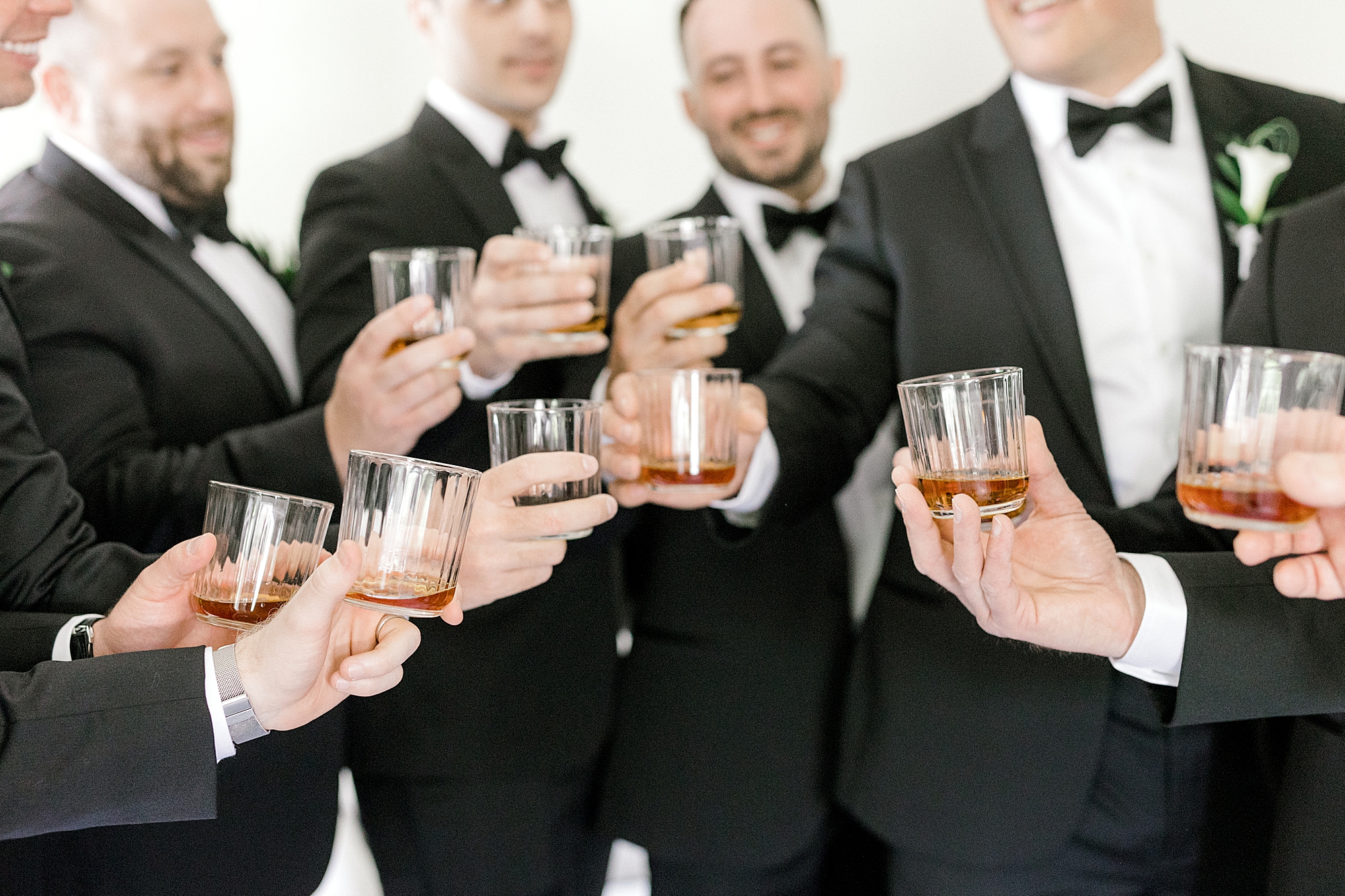 groom and groomsmen toast drinks at Indian Trail Club