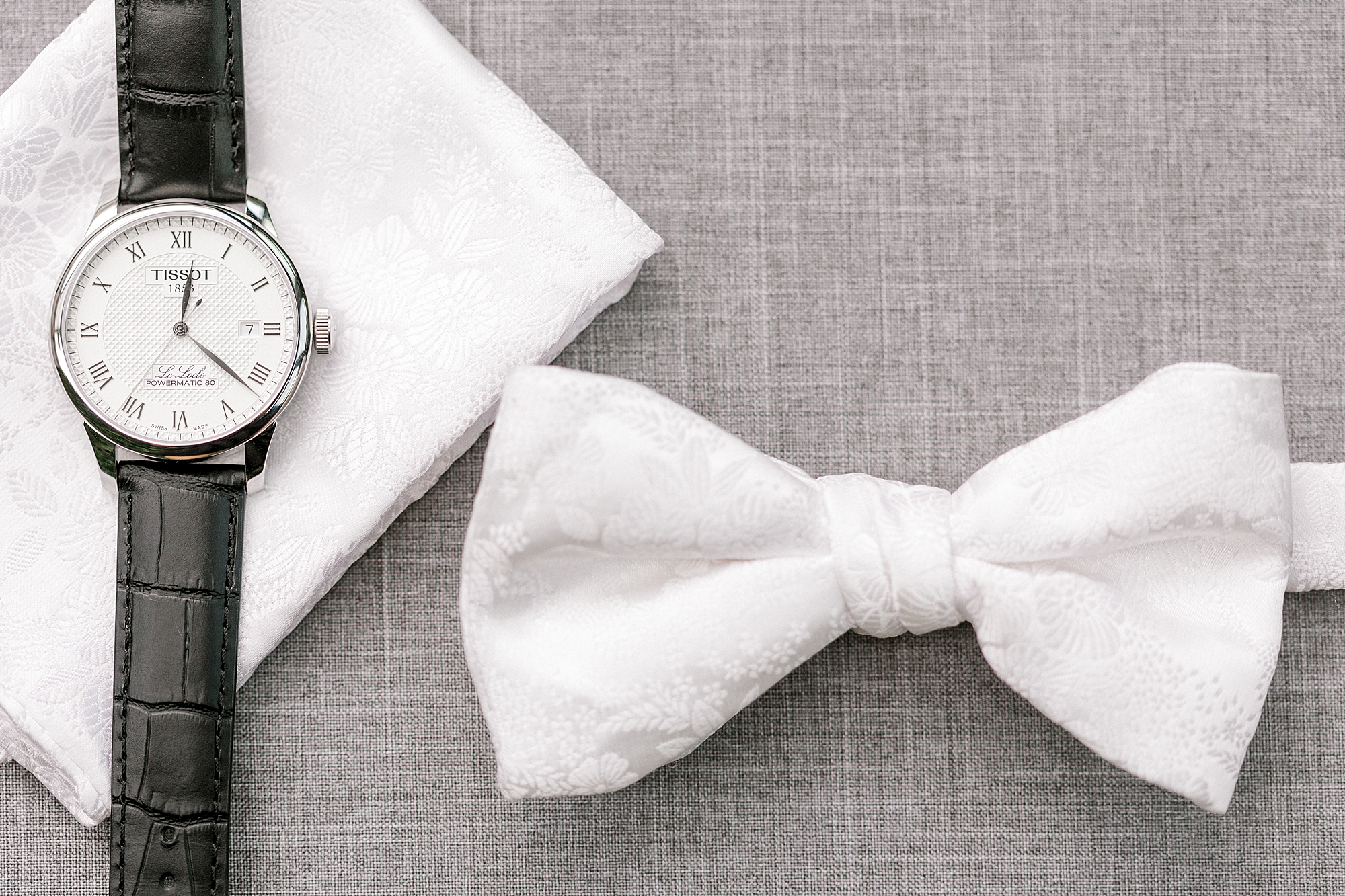 groom's watch and white bow tie at the Refinery at Perona Farms