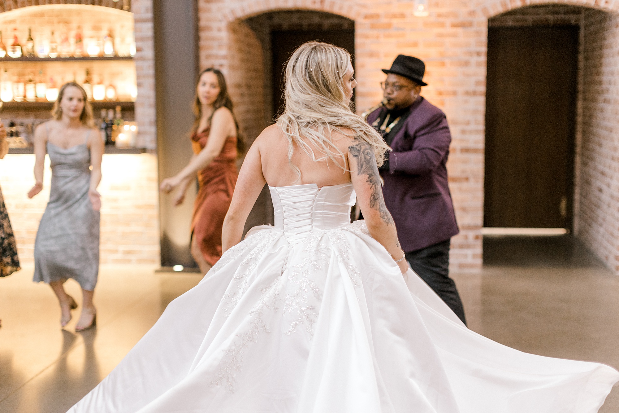 bride twirls cut wedding dress during NJ wedding reception