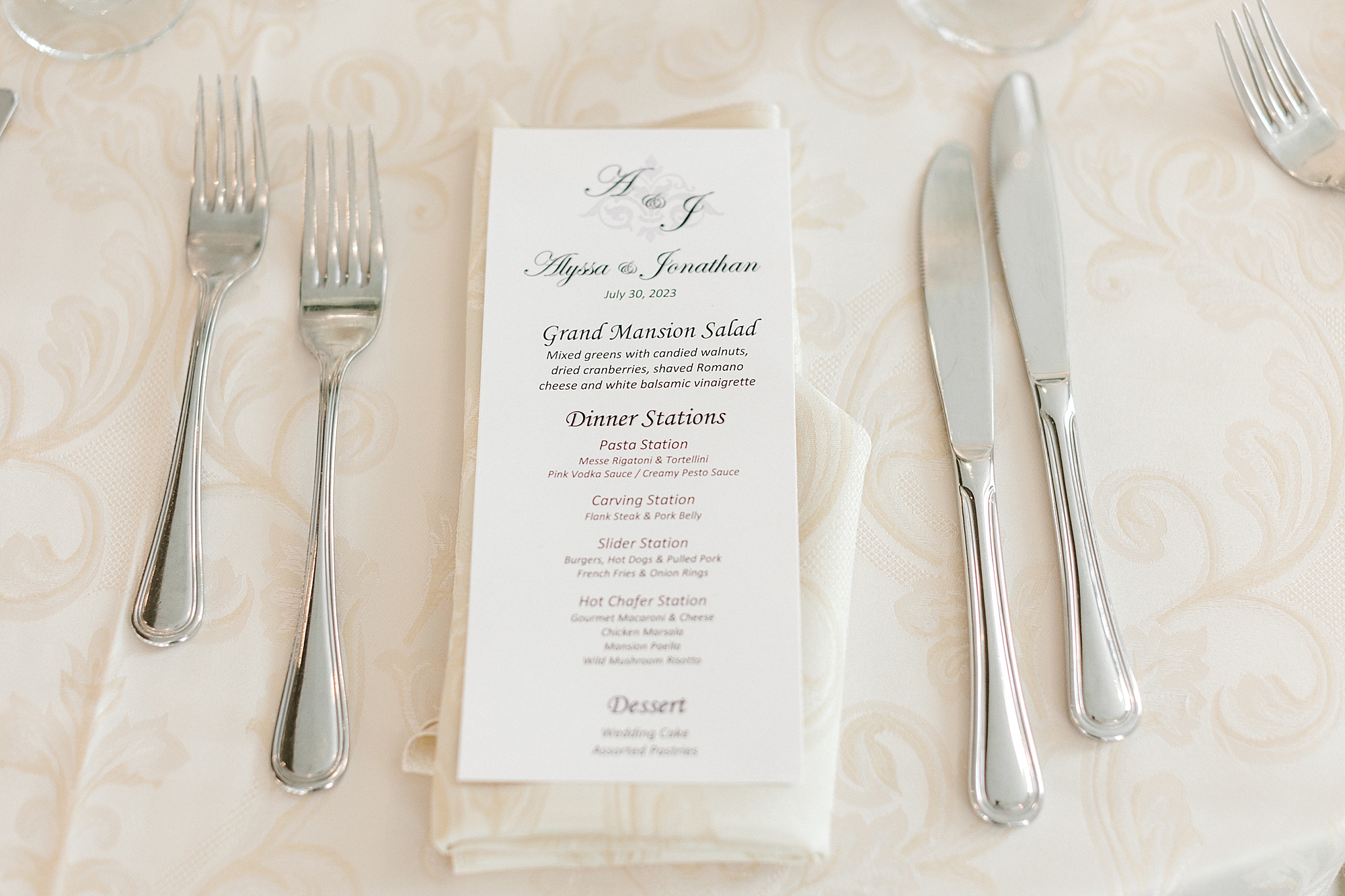 menu card rests on ivory napkins for wedding reception at the Mansion at Mountain Lakes