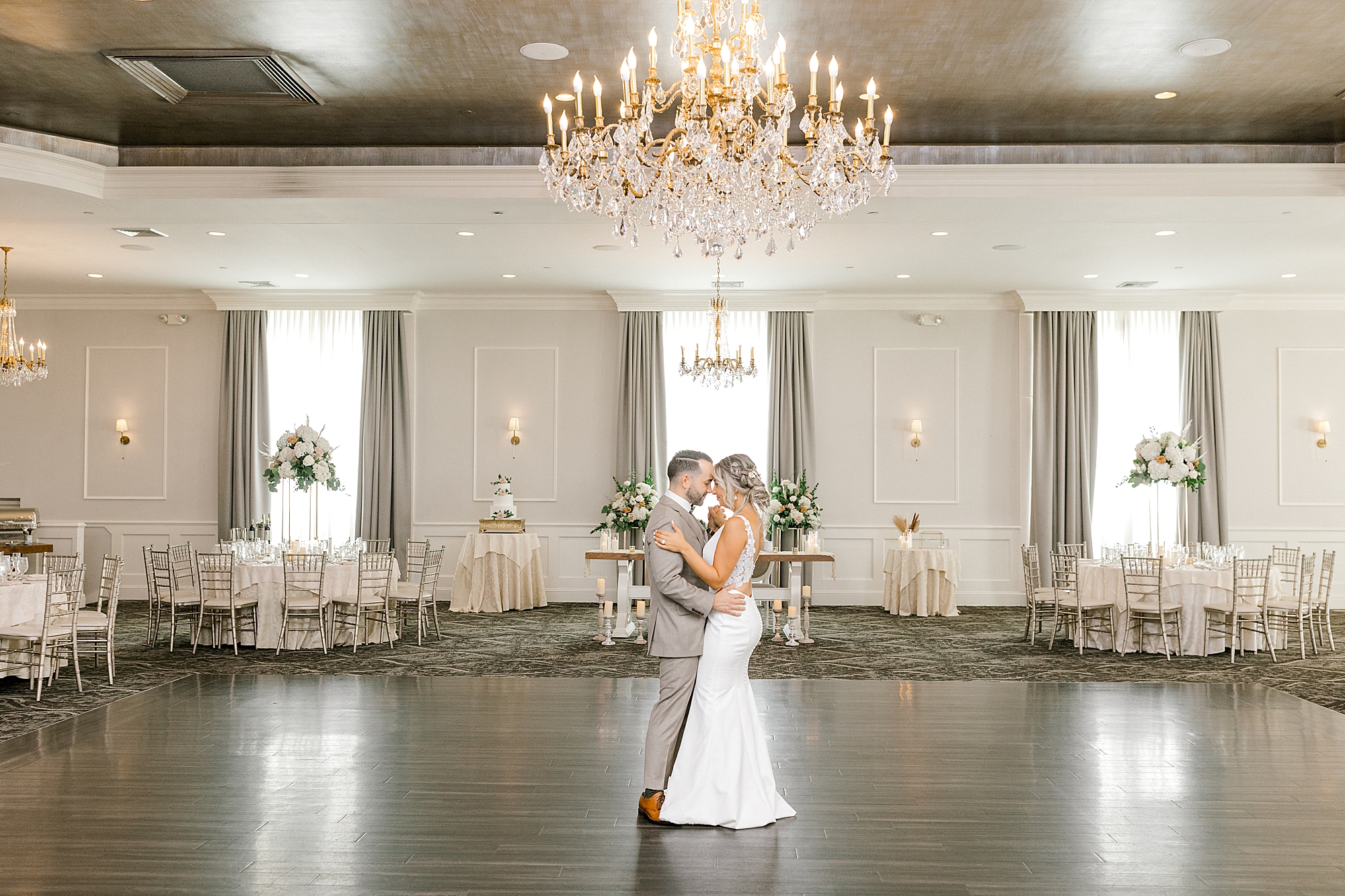 bride and groom dance in empty ballroom at the Mansion at Mountain Lakes