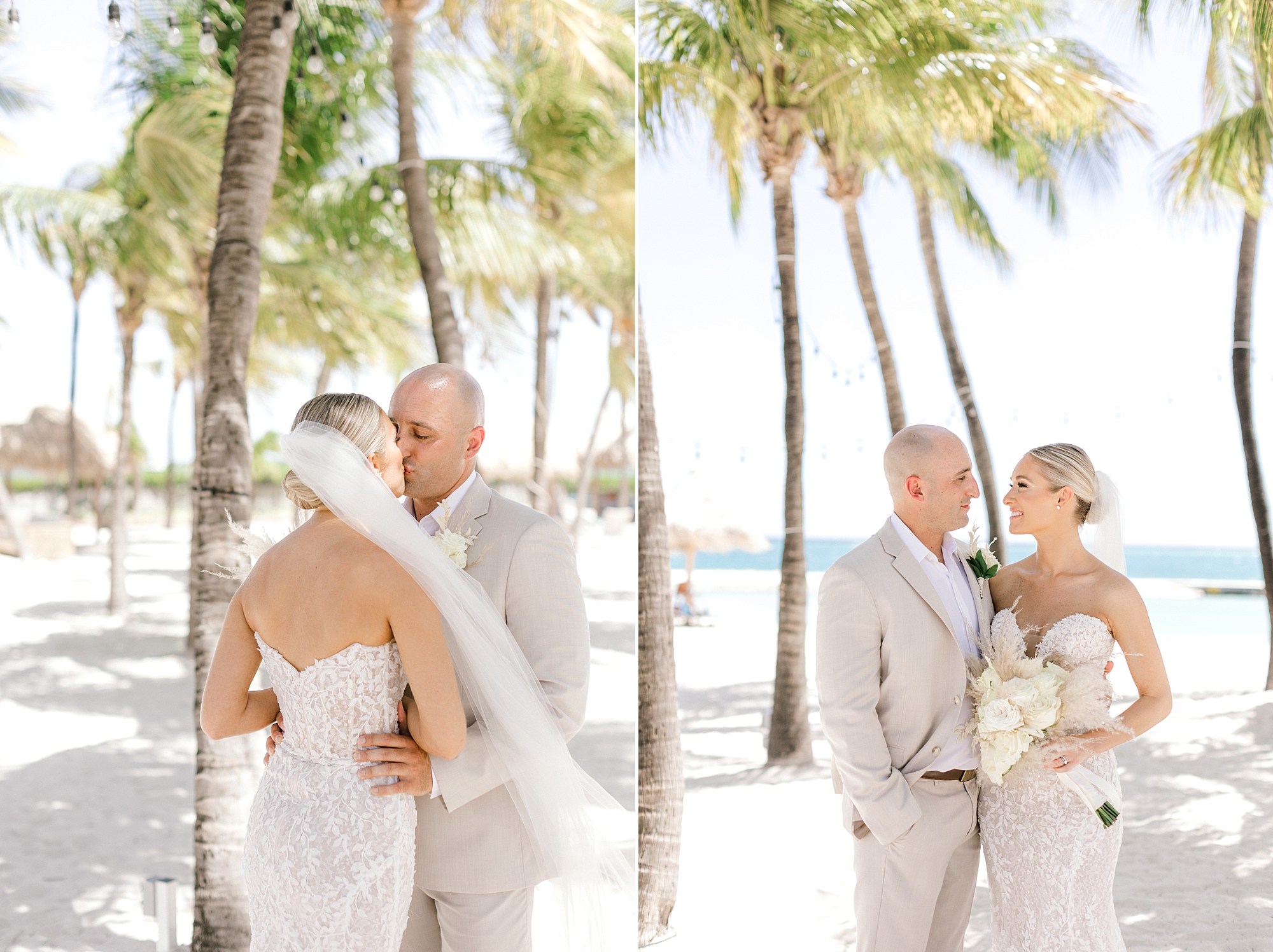 newlyweds hug under palm trees during the Renaissance Aruba hotel
