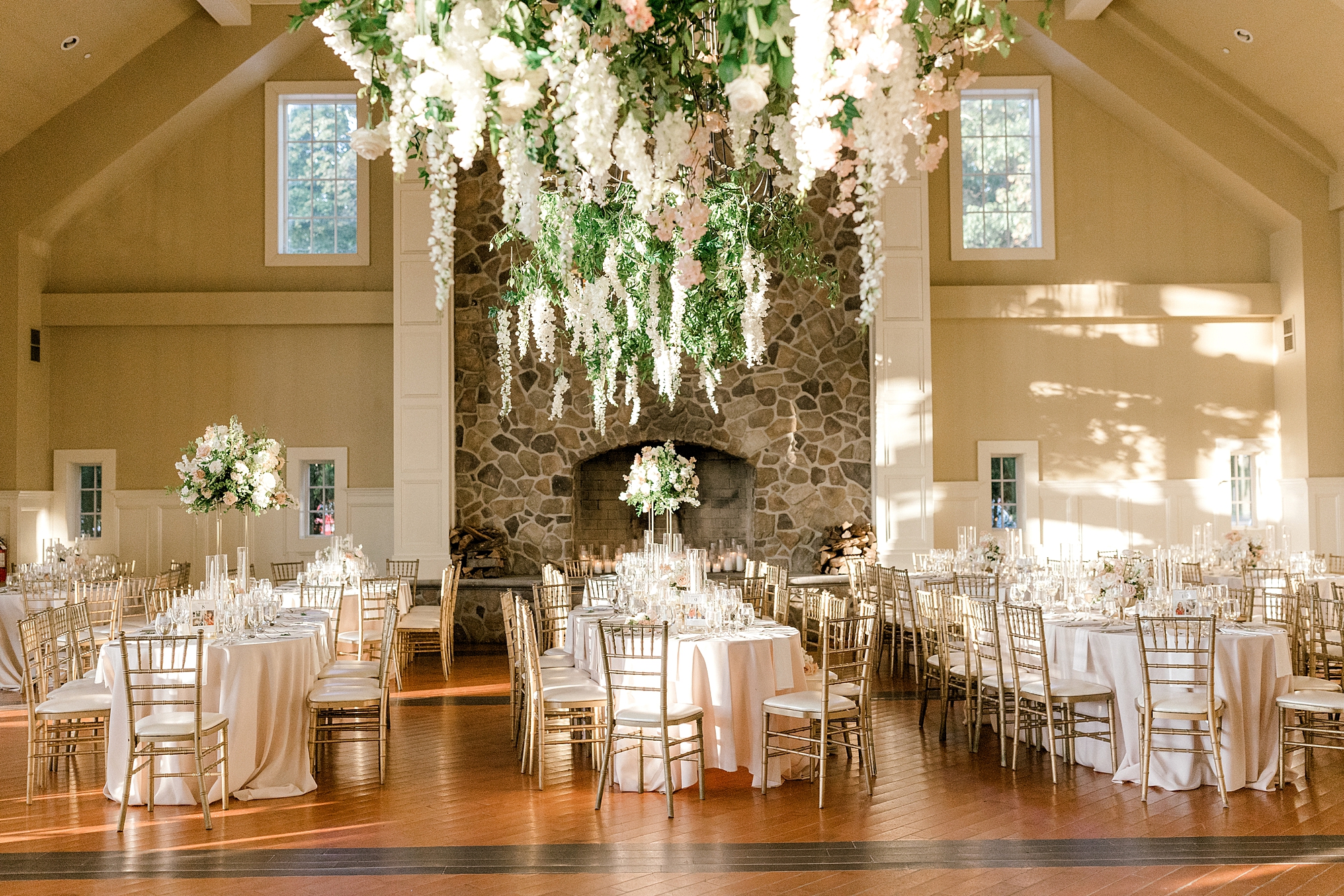 luxurious summer wedding reception at Ryland Inn with hanging greenery display