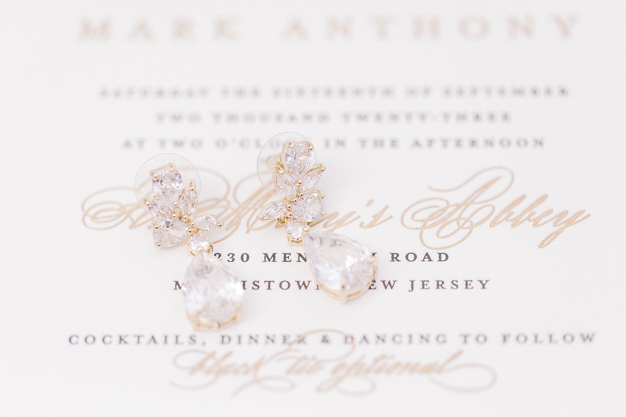dangling pearl earrings on stationery set at the Farmhouse