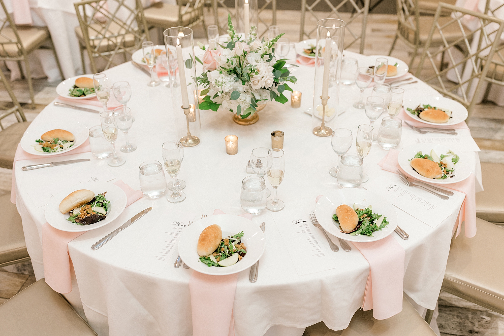 place setting for summer wedding reception at the Farmhouse with gold and white details