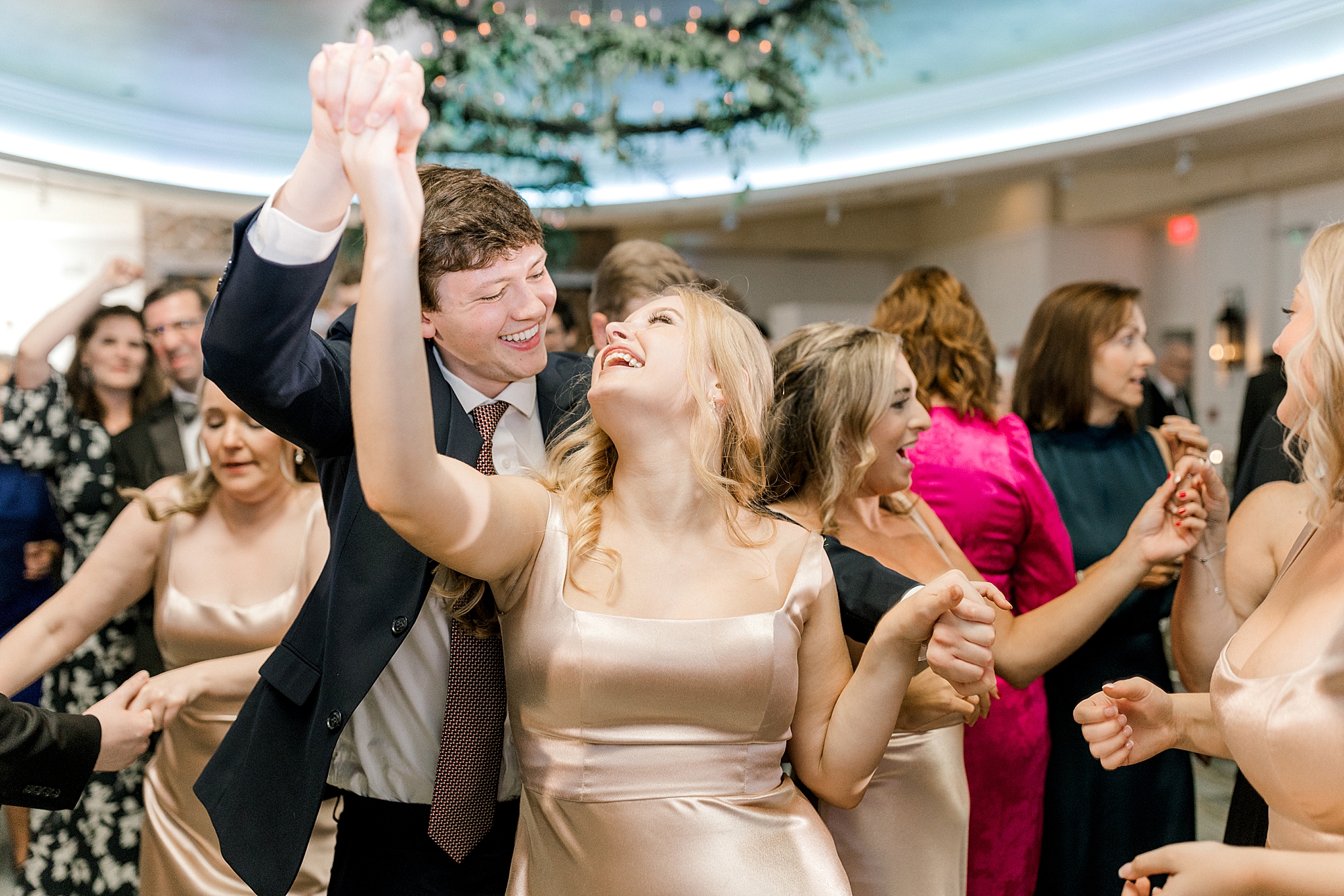 bridesmaid dances with date at during Hampton NJ wedding reception
