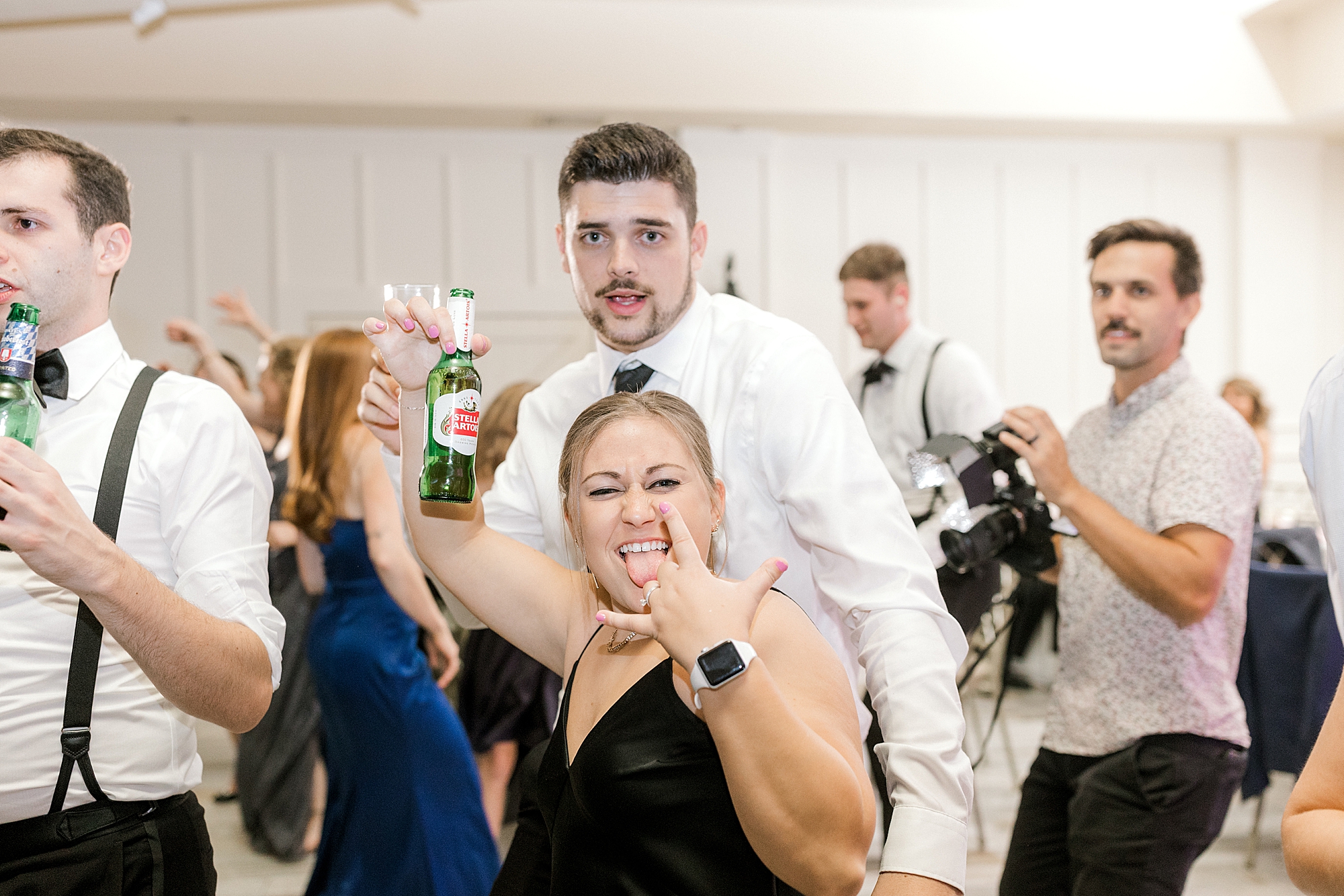 wedding guests make silly faces at camera during during Hampton NJ wedding reception