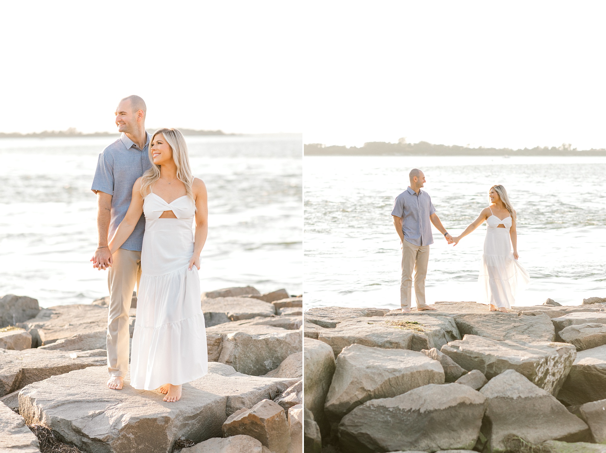 engaged couple hold hands standing on rocks near Barnegat Lighthouse