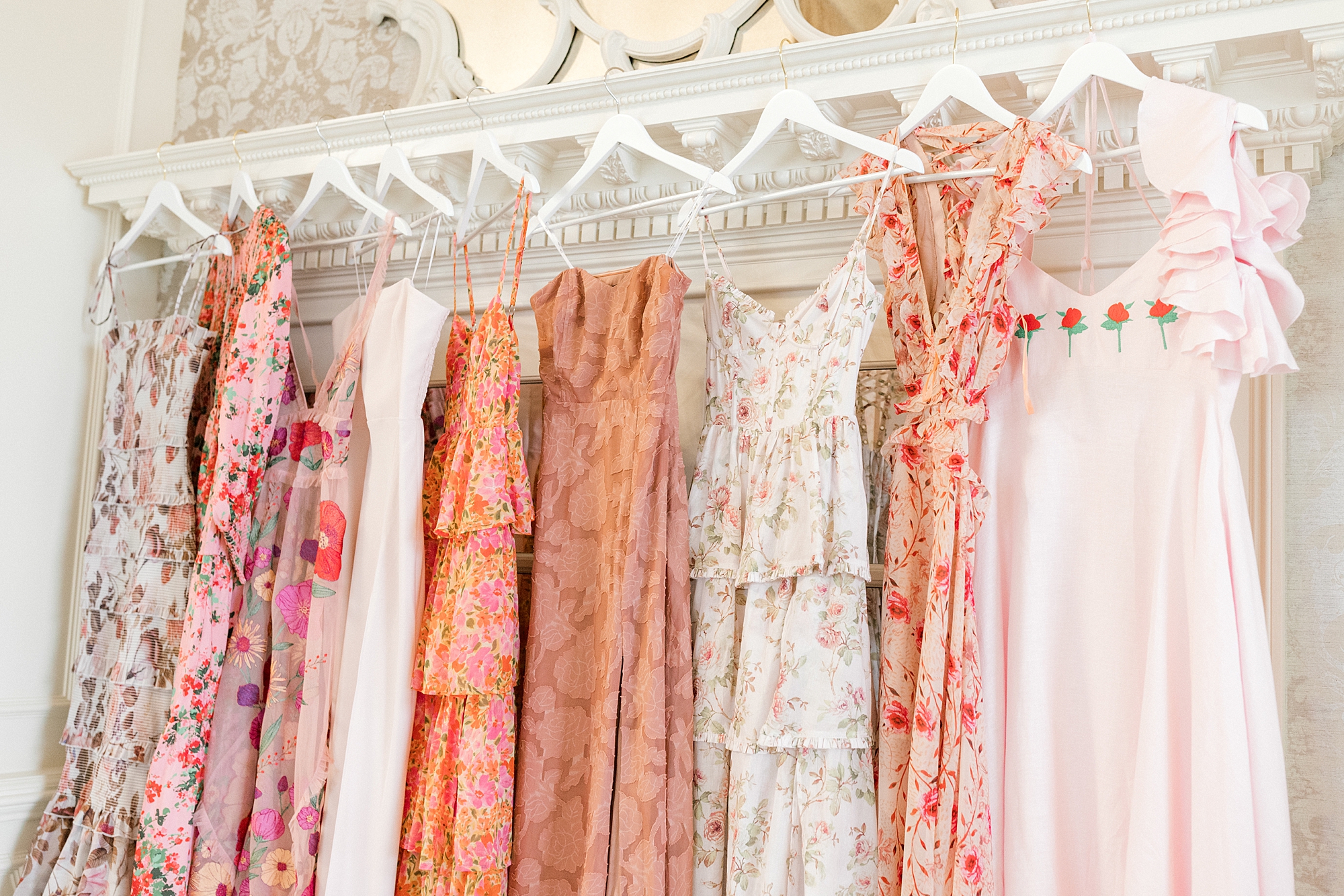 mismatched pink and peach gowns for bridesmaids at Mallard Island Yacht Club