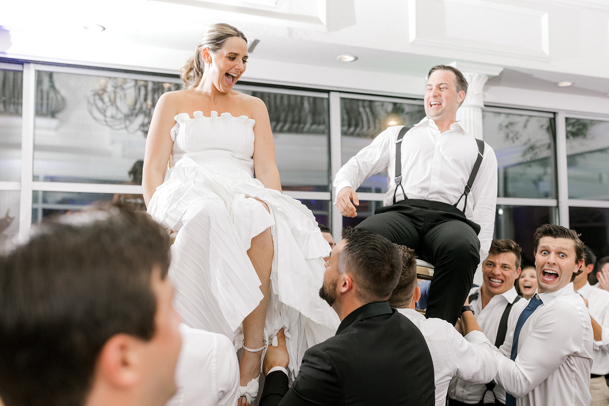guests lift up bride and groom during Long Beach Island wedding reception