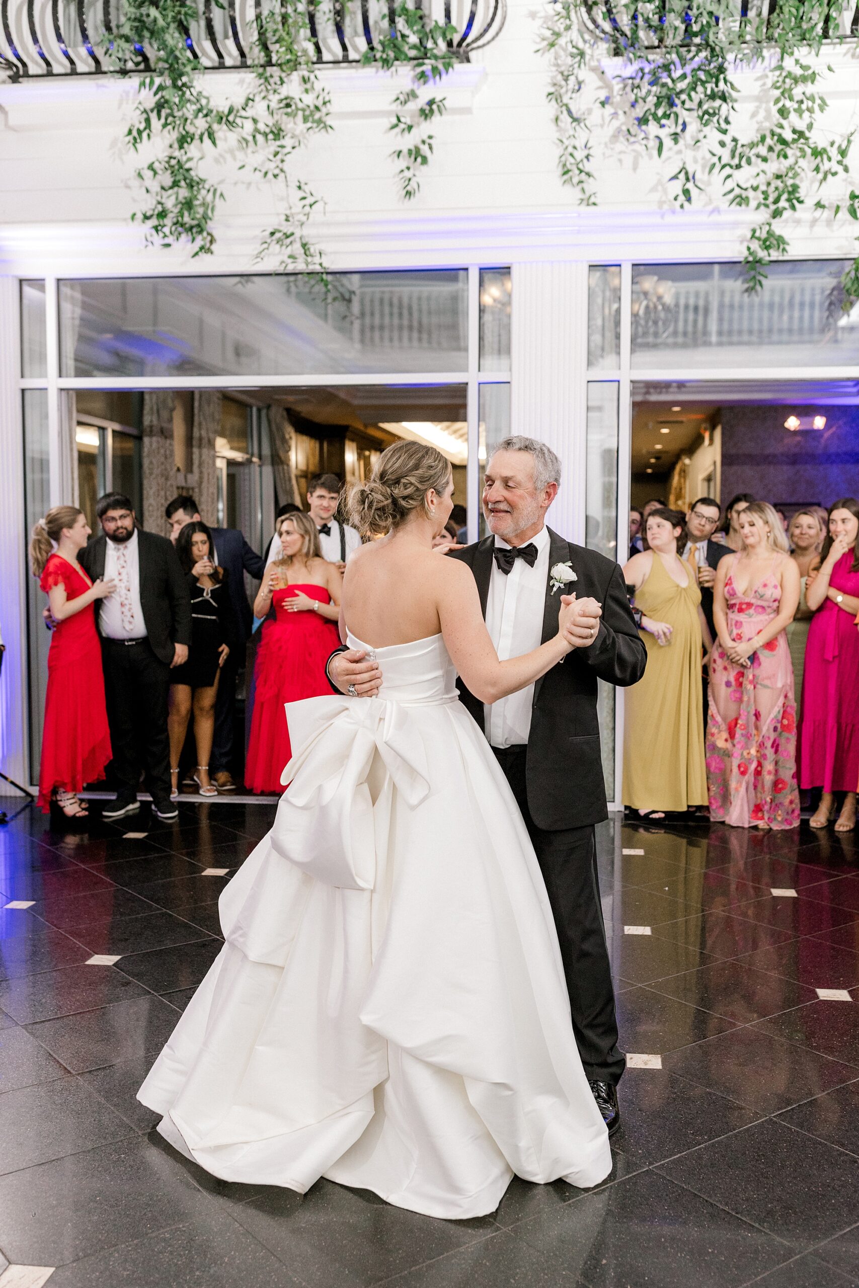 bride dances with father during wedding reception at Mallard Island Yacht Club