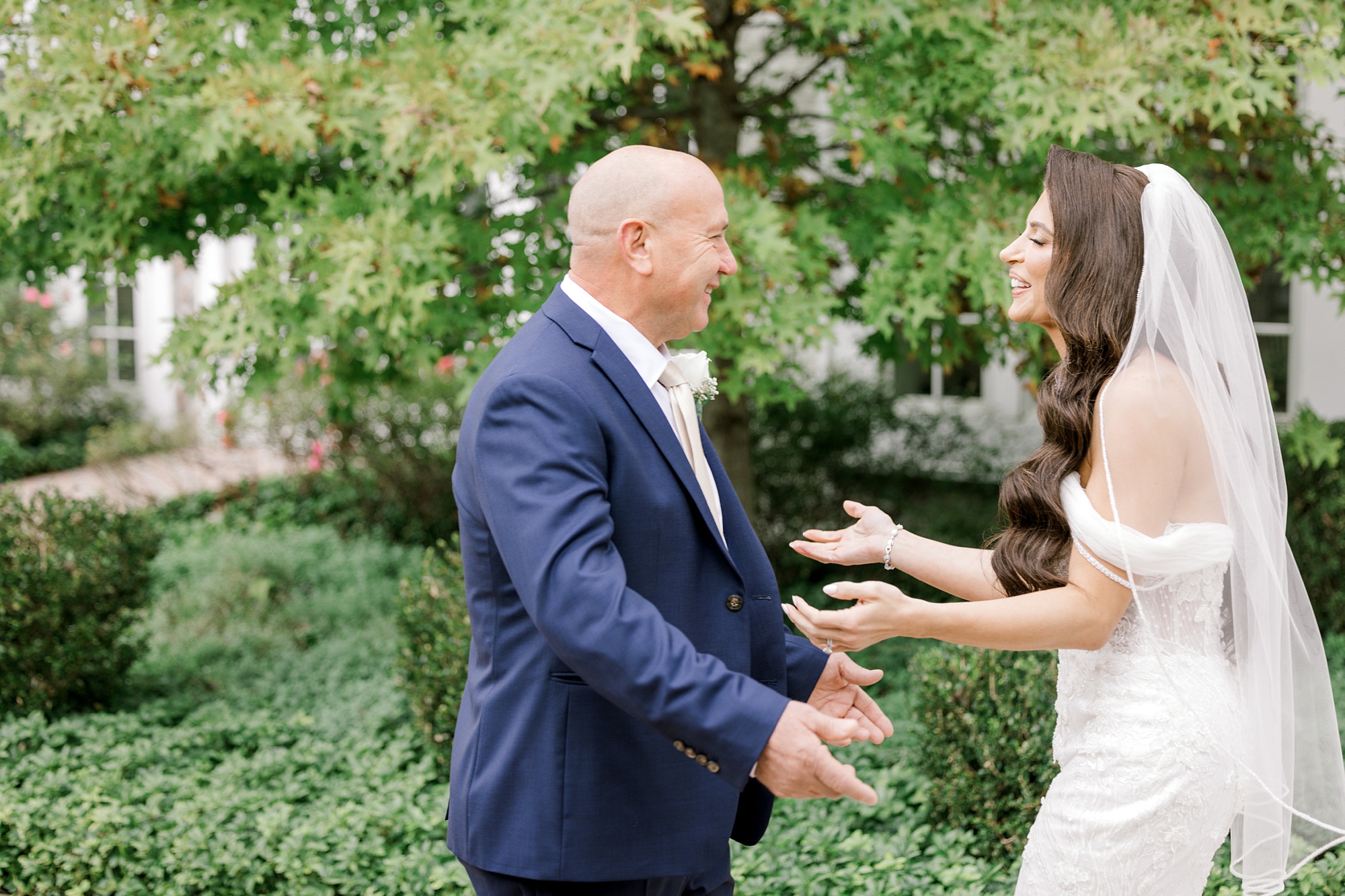 bride reaches for dad for first look during fall wedding